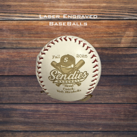Laser-engraved leather baseball featuring custom artwork and text