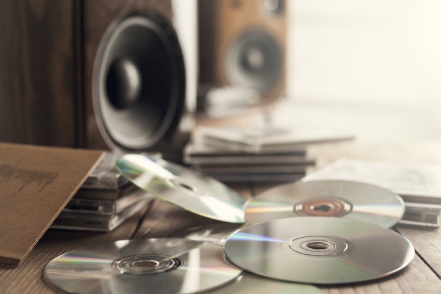 Scattered CDs in front of a speaker